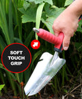 Hand using Multi Digger Dual Grip Garden Hand Trowel With Soft Touch Ergonomic Handles for powerful digging in garden.