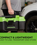 Person holding Cordless 40V 3 Gallon Wet Dry Shop Vacuum With Extras, 450W Suck Power, 67 CFM Air Flow near a car