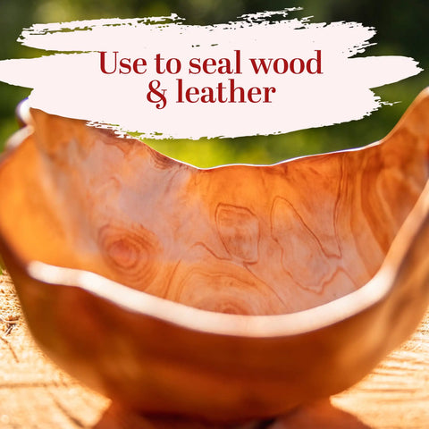 Straight Up Pure Carnauba Wax Flakes For Smooth Skin Care And Lip Balm Making Real Deal Vegan Candle Wax With Leather And Wood Finish Must Have DIY Staples Eight Ounce Bag in a wooden bowl.
