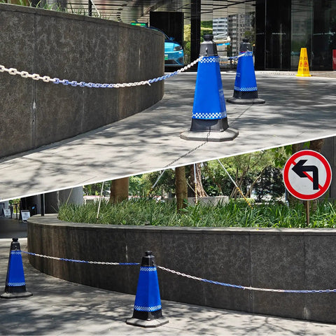 Heavy Duty Black Plastic Chain Links 30 Feet for Barriers and Crowd Control in use with traffic cones on a sidewalk.