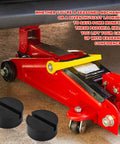 2 Pack Rubber Floor Jack Pad Kit For Universal Car Lifts And Jack Stands Heavy Duty Slotted Frame Rail Pinch Weld Protection Anti Slip Thick Rubber Pads Sized 2.8 Inch Diameter And 1.3 Inch Tall shown near a red floor jack lifting a car