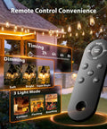 Remote showing features of 33 Feet Solar String Lights Outdoor With Remote, Waterproof Shatterproof Patio Lights hanging in yard.