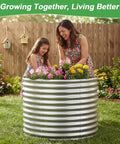 Woman and child gardening with flowers in a Two Pack Round Galvanized Raised Garden Bed For Outdoor Use, 3 By 3 By 3 Feet.