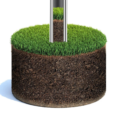 Pro Grade 36 Inch Stainless Steel Soil Probe with Two Piece Design extracting soil core from lush green lawn.