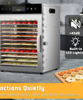 Heavy Duty 12 Tray Electric Food Dehydrator For Slick Batch Prepping Of Jerky Dried Fruit Veggie Chips And Pup Chews With 800 Watt Heating Dual Fan Setup And Reliable Digital Timer Controls, stainless steel, with food inside.