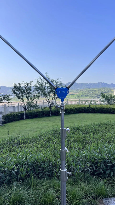 Image of Grab And Go Portable Ham Radio Antenna Kit With Tripod For 7 To 430 MHz Inverted V Design set up outdoors.