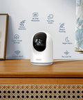 2K Indoor Security Cam Bundle 4-Pack, 360-Degree Motion Detection For Pets And Baby, Two-Way Audio device on wooden desk