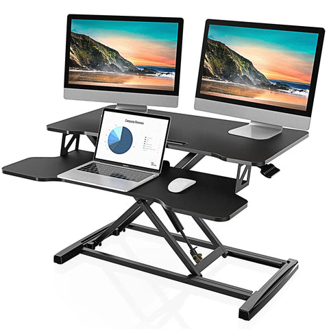 Epic Height Adjustable Sit To Stand Desk Converter for dual monitors and laptop with 31.5 inch wide top surface in use