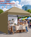 Boss Level 8X8 Pop Up Canopy Tent With Two Full Sidewalls For All Weather Shade Rock Solid Khaki Frame at an outdoor market.