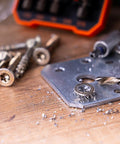 Hardworking Stubby Left Hand Reverse Drill Bit and Screw Extractor Set used on metal plate with screws
