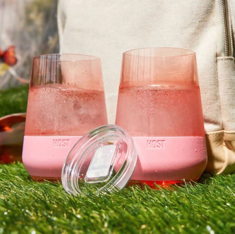 Freezable Stemless Wine Glasses With Secure Lids, Double Wall Insulated Chiller Tumblers For Grab And Go Vibes, Keep Your Sip Ice Cold Outside, 12 Oz Set Of Two Pink Blush Drinkware For Her on grass with water.