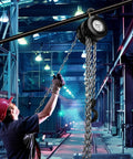 Worker using 2 Ton Hand Chain Hoist With 4400 Lbs Capacity 10 Foot Lift Manual Chain Block in industrial warehouse setting