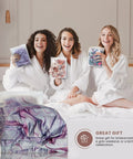 Three women in robes smiling, holding packs, with Reusable Waterproof Shower Cap For Women with Nonslip Silicone Forehead Strip visible in front.