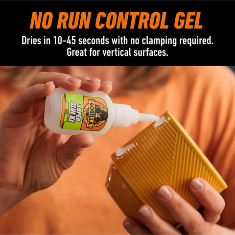 Rock Solid Super Glue Gel No Drip Formula For Precision Repairs And Vertical Fixes Quick Setting Anti Clog Bottle Clear Adhesive Heavy Duty Bonding Pack Of Two. Hand holding bottle applying glue to a ceramic surface.