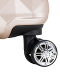 Close-up of wheel on Diamond Tower Hardside Luggage With Expandable Design Rose Gold Finish Eight Wheel Spinner Travel Case