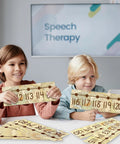 Children holding Travel Map Number Line Set From Negative 20 To Positive 120 For Math Class 29 Pieces with Adhesive Dots.