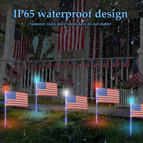 Six Pack 30 LED Solar Patriotic Pathway Lights With 6 US Flags And Flag Stakes Bright Red White And Blue Outdoor Yard Decor For Fourth Of July Memorial Day Lawn Garden in rain showcasing IP65 waterproof design