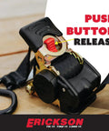 Close-up of 2 Inch By 10 Foot Black Retractable Ratchet Tie Down Straps with auto retract and one button release, 3300 lb load