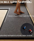 Person standing on L Shaped Kitchen Mat With Anti Slip Corners For Floor In Front Of Sink Absorbent Washable Runner Rug For Home Kitchen Office Black Brown Right L 6 Foot 7 Inch By 4 Foot 7 Inch with visible herringbone rubber backing.