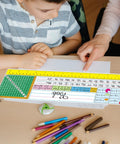 Child learning with 40 Piece Waterproof Desk Nameplates For Classroom Use Kid Friendly Multipurpose Name Tags, featuring math tables.