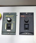Control panel of Automatic Desktop Conveyor Roller Labeling Machine for round bottles; includes speed and emergency stop buttons.