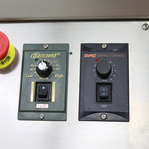 Control panel of Automatic Desktop Conveyor Roller Labeling Machine for round bottles; includes speed and emergency stop buttons.
