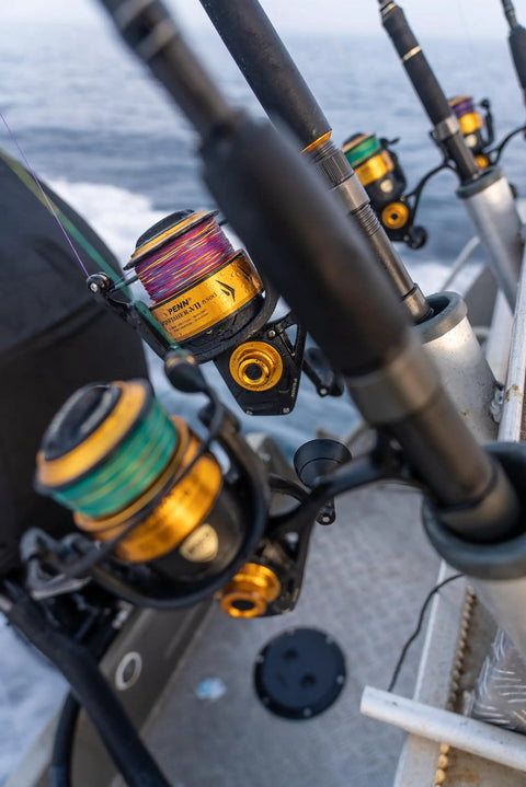 Spinfisher VII 3500 saltwater spinning reels on rods, IPX5 seal, aluminum spools visible, offshore fishing setup.
