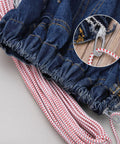 Fast And Easy No Fuss Drawstring Threader Tool For Jackets Pants Shorts And Hoodies, shown threading through denim drawstring.