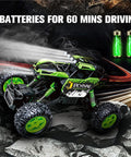 All Terrain RC Monster Truck For Kids With Upgraded Lifting Function 2.4GHz Four Wheel Drive Remote Control Car Toy Gift Delivers About 20 Kilometers Per Hour Speed LED Lights Big Anti Slip Wheels Green on rocky terrain with batteries displayed.