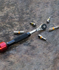 Go To One Quarter Inch Hex End EDC Ratchet Wrench For Multitools With Hex Bit Adapters Stainless Steel Build on stone surface
