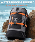 Waterproof Dry Bag Backpack 40L for Men and Women Roll Top on rocks by the sea, grey with orange straps, rugged and heavy duty.
