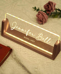 Personalized Acrylic Desk Name Plate With Light Up Base featuring 'Jennifer Bell' as Boss Lady on wooden LED base with roses in background