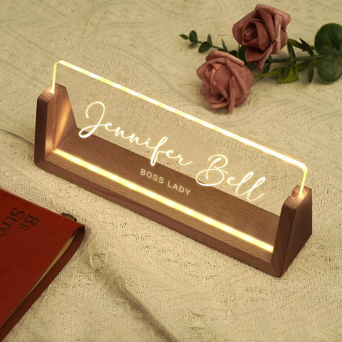 Personalized Acrylic Desk Name Plate With Light Up Base featuring 'Jennifer Bell' as Boss Lady on wooden LED base with roses in background