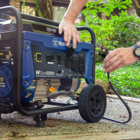 6600 Peak Watt Portable Generator With Transfer Switch Ready 30A RV Receptacle being connected outdoors