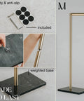 Free Standing Gold Toilet Paper Holder Stand With Black Marble Base And Storage No Drill Hassle Free Setup Fits 4 Jumbo Rolls Stainless Steel Bathroom Tissue Organizer Modern Bath Decor Accessory with anti-slip pads and weighted base.