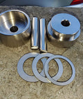 Total Game Changer Coin Ring Punch Set With Four Sleek Self Centering Tools For Relaxing Jewelry Crafting Heavy Steel Punchers laid on stone.