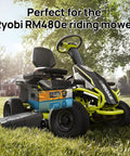 Beefy 48V 50Ah LiFePO4 Battery With Metal Case in Ryobi RM480e Riding Mower on grass, trees in background