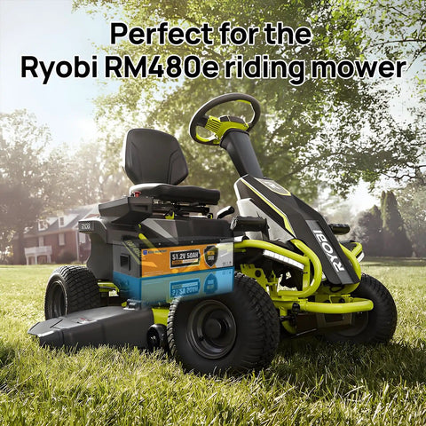 Beefy 48V 50Ah LiFePO4 Battery With Metal Case in Ryobi RM480e Riding Mower on grass, trees in background