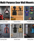 Multi-purpose gear wall mounts displaying motorcycle, tactical, football, cycling, airsoft, and skiing gear with Heavy Duty Wall Mount Tactical Gear Stand Holds Up To 100 Lbs With Solid Wood Frame And Rust Proof Steel A Rugged Rack For Police Gear Body Armor Plate Carriers Airsoft Plates And Motorcycle Helmets.