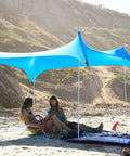 Two Extra Poles For Grande Neso Tent Replacement Kit setup with shade on beach, five section 7 foot aluminum poles, foam top ball visible