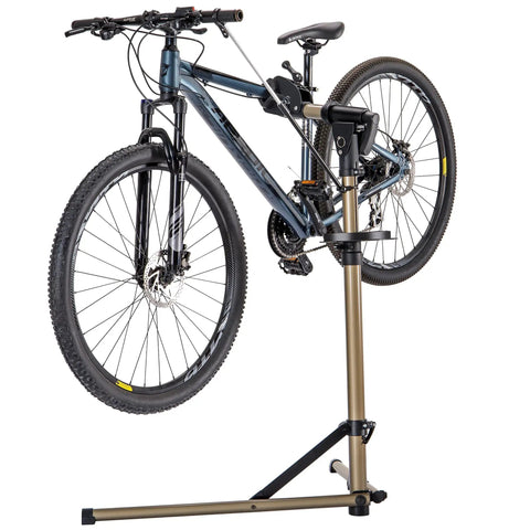 Heavy Duty Bike Repair Stand With 360 Degree Rotating Clamp Holds 1 In To 1.75 In Tubes Rubber Protected 80 Lb Capacity Pro Grade Workstand For Mountain And Road Bikes At Home Or Shop holding a mountain bike