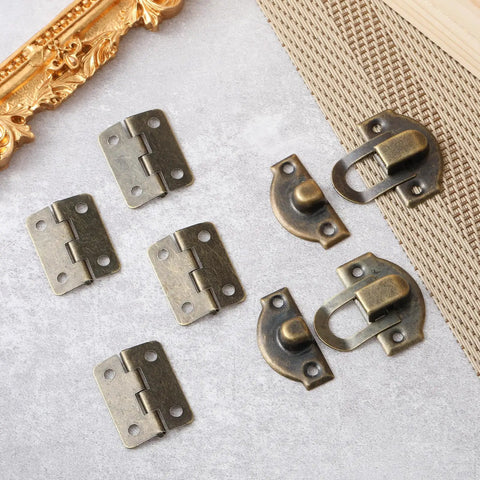 Retro Antique Bronze Small Box Hinges Kit For Wooden Boxes And Jewelry Boxes displayed on a table with latches and screws