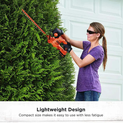 Woman using 20V Max Hedge Trimmer Kit with 18-Inch Blade and dual-action hardened steel blades for quick yard cleanup