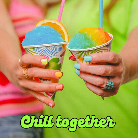 Electric Shaved Ice Machine Kit With Bold Syrup Blends And Twenty Slurp Season Cups showing colorful slushies in cups.