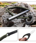 Six Inch Ferro Rod Fire Starter Kit With Paracord Lanyard Handle And Striker on rocky surface, for hiking and camping