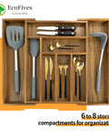 Expandable Acacia Kitchen Drawer Organizer with Grooved Dividers Eight Slot Silverware Tray with utensils inside