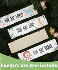 4 Piece Baby Nursery Wall Art Set Unframed Woodland Animal Prints With Inspirational Quotes For Boys And Girls Cute Adorable Bedroom Decor To Inspire A Cozy Playful Kid Space, four pieces displayed on grass with pre-installed hangers, each featuring a woodland animal with motivational quotes 'You Are Loved,' 'You Are Kind,' and 'You Are Brave,' suitable for kids' rooms, each 30x8 cm, 5 mm thick