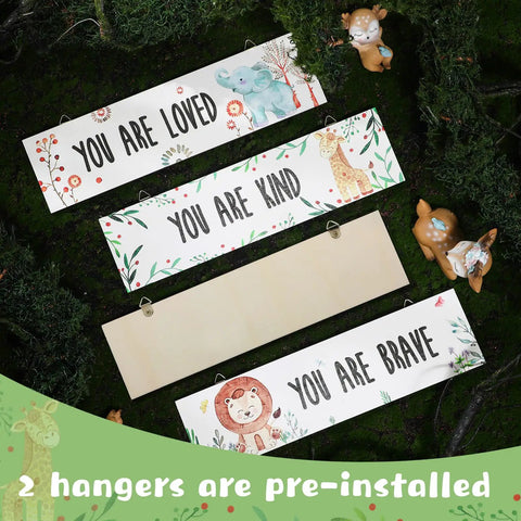 4 Piece Baby Nursery Wall Art Set Unframed Woodland Animal Prints With Inspirational Quotes For Boys And Girls Cute Adorable Bedroom Decor To Inspire A Cozy Playful Kid Space, four pieces displayed on grass with pre-installed hangers, each featuring a woodland animal with motivational quotes 'You Are Loved,' 'You Are Kind,' and 'You Are Brave,' suitable for kids' rooms, each 30x8 cm, 5 mm thick