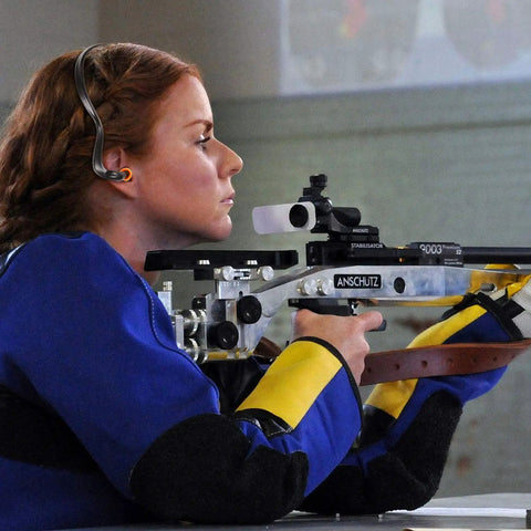 Person wearing 48 Pieces Banded Ear Plugs With Neck Band Silicone Hearing Bands For Shooting, using a rifle.