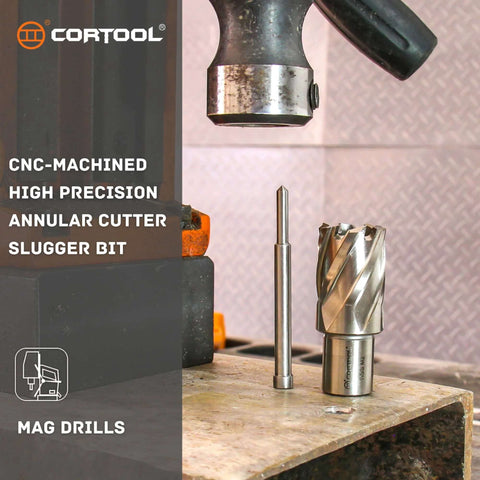 Front view of Cortool 1-in diameter annular cutter with pilot pin and mag drill chuck on workbench